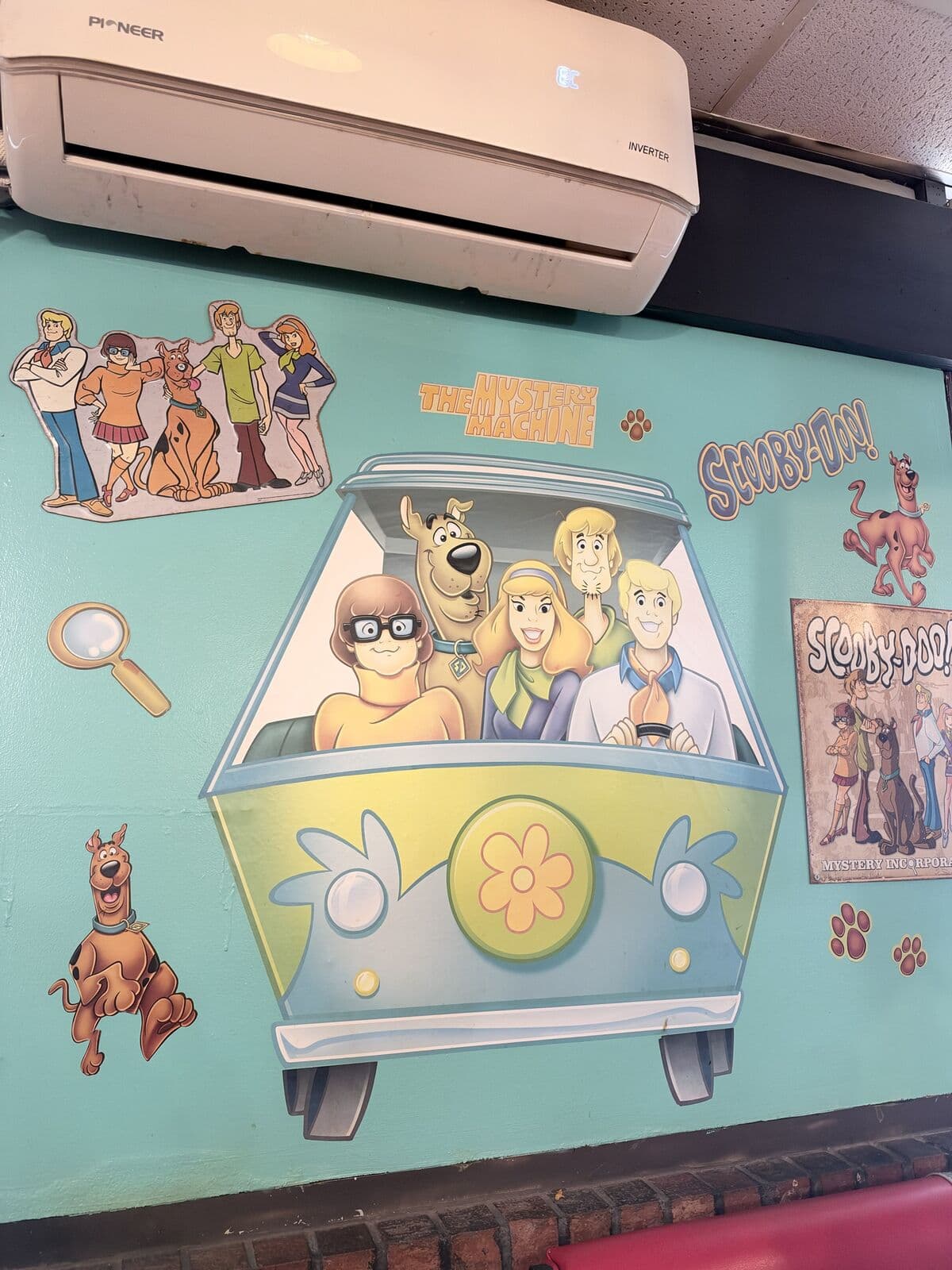 The Mystery Machine and the Scooby-Doo gang painted on the wall